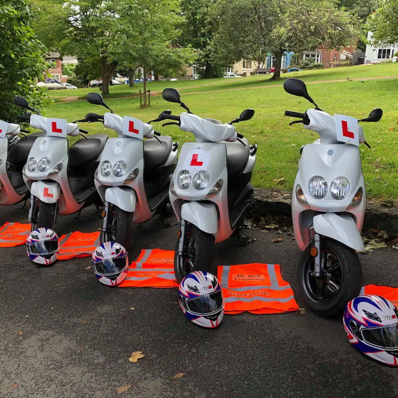 A row of scooters with L plates on A row of scooters with L plates on